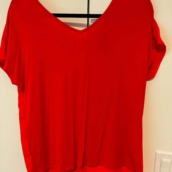 Loose fit red top. Cute tie detail on back. Size medium. New - Picture 2 of 2